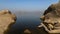 Landscape of Jawai dam with water, clear blue sky and Aravalli mountain ranges