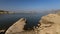 Landscape of Jawai dam with water, clear blue sky and Aravalli mountain ranges