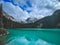 Landscape of the Joffre Lakes surrounded by forests under a cloudy sky in Pemberton, Vancouver