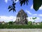 Landscape Kalasan Temple Candi, Sleman, Central Java Buddhist cross shaped stone, historical landmark, leaf trees silhouette