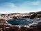 Landscape of Kerio crater frozen lake in Iceland. Geothermal area in winter