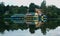 A landscape of kodaikanal boat house at early morning with reflections.