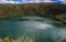 Landscape of the Laguna del Cacique Guatavita surrounded by greenery under the sunlight in Colombia