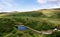 The landscape with a lake below of Faerie Castle Castle Ewen at the Fairy Glen in Isle of Skye in Scotland