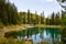 Landscape of Lake Carezza or Karersee and Dolomites in background, Nova Levante, Italy