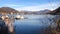 Landscape of lake Lugano and Swiss Alps in Lavena Ponte Tresa, changing focus.