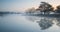 Landscape of lake in mist at sunrise