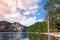 Landscape with lake, pine trees and mountains