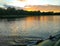 Landscape with lake surface and fragment of paddle of inflatable boat.