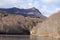 Landscape of a lake surrounded by hills covered in beech forests in Montseny Natural Park, Spain