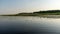 Landscape on the lake, water lilies and reeds, reflections in the water