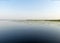 Landscape on the lake, water lilies and reeds, reflections in the water