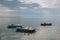 Landscape of Lake with water wheels, horizon, gentle cloudy skies.