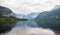 Landscape. Lakeside and snowy mountains at the cloudy day