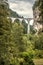 Landscape with Landwasser Viaduct, Filisur, Switzerland. Scenic vertical view of high railway bridge in Alps. Beautiful Swiss