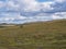 Landscape of Lapland nature at Kungsleden hiking trail with lonely birch tree, colorful mountains, rocks, autumn colored bushes