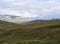 Landscape of Lapland nature at Kungsleden hiking trail with reindeers, colorful mountains, rocks, autumn colored bushes, birch