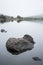 Landscape of Llyn Crafnant during foggy Autumn morning in Snowdo