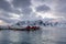 Landscape of the Lofoten Islands in Norway with traditional wooden red fisherman huts in front of the sea and this beautiful mouta