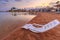 Landscape of lonely beachchair near sea and beautiful sunset.