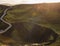 Landscape of Lush Green Mossy Volcanic Crater, or Caldera, and Wooden Stairs with Backlit Tourists