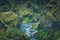 Landscape of lush rugged volcanic mountain valley with river flowing in summer on Icelandic highlands at Thorsmork