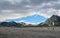 Landscape of Maelifellsandur volcanic black sand desert with Myrdalsjokull glacier and blue sky, summer in Highlands of Iceland