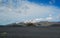 Landscape of Maelifellsandur volcanic black sand desert with Tindafjallajokull glacier and blue sky, summer in Highlands of
