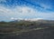 Landscape of Maelifellsandur volcanic black sand desert with Tindafjallajokull glacier and blue sky, summer in Highlands of