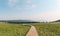 Landscape of Malun alpine pasture with wooden paths