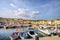 Landscape with marina in bay of Cassis resort town at sunset. France, Provence