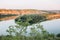 Landscape meandering channel rocks canyons green vegetation