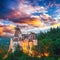 Landscape with medieval Bran castle known for the myth of Dracula at sunset