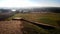 Landscape of the medieval Lithuanian capital Kernave from above with mounds sunken in fog.