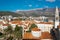 Landscape of of Mediterranean old town Budva, Montenegro. Ancient walls and red tiled roofs