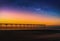 Landscape with Milky way galaxy and Sunset over pier at Saltburn by the Sea, North Yorkshire, UK.