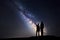 Landscape with Milky Way. Silhouette of a father and son