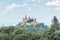 Landscape of misty mountain with Gothic Hohenzollern Castle in summer morning, Germany. Old Burg Hohenzollern is landmark in