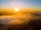 Landscape misty panorama fantastic dreamy sunrise on foggy clouds above forrest