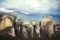 Landscape of monasteries of Meteora in Greece in Thessaly at the early morning. Cliffs of Meteora opposite a morning cloudy sky ba