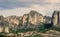 Landscape of monasteries of Meteora in Greece in Thessaly at the early morning. Cliffs of Meteora opposite a morning cloudy sky ba