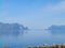 Landscape of the mountain covering by tree on the seacoast under the clear blue sky