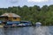 Landscape with mountain meadows, forest, house and small wharf  near artificial Vlasina mountain lake