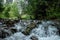 Landscape, mountain stream, cascades on a mountain river. The concept of active holidays, holidays