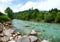 Landscape with mountains trees and rapids of river Salza in front