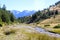 Landscape of the mountains, trees, steam and the sunny sky in the Pyrenees