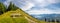 landscape with mountains with wooden bench and footpath, the Zwolferhorn mountain and Lake Wolfgangsee, Alps, Austria