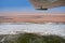 Landscape of the Namib Desert and Skeleton Coast under the wing of the aircraft, Namibia Africa