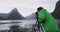 Landscape nature travel photographer tourist taking photo of Milford Sound and Mitre Peak in Fiordland National Park