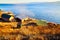 Landscape with old wooden house near lake with blue water and sky. Lake Baikal. A tourist sightseeing train moves along the Circum